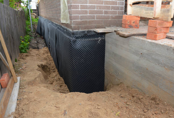 Happy homeowners after waterproofing job in Gallant